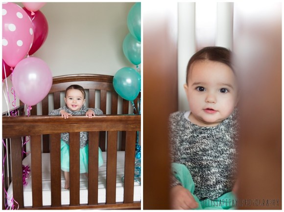"baby girl with balloons in crib image"