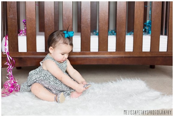 "baby trying on shoes picture"