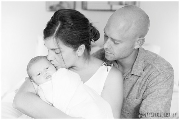 "mother, father and newborn picture"